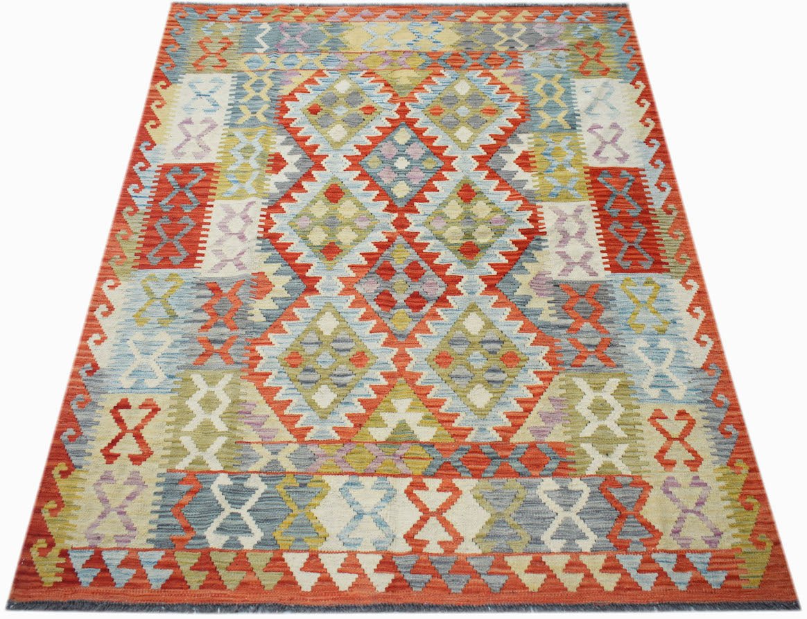 Handwoven Afghan Maimana kilim rug featuring a geometric diamond pattern in vibrant wool colors.