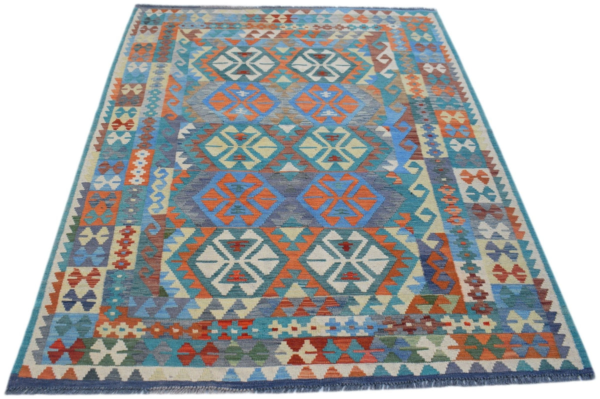 Handwoven Afghan Maimana kilim rug featuring a vibrant geometric pattern in wool.