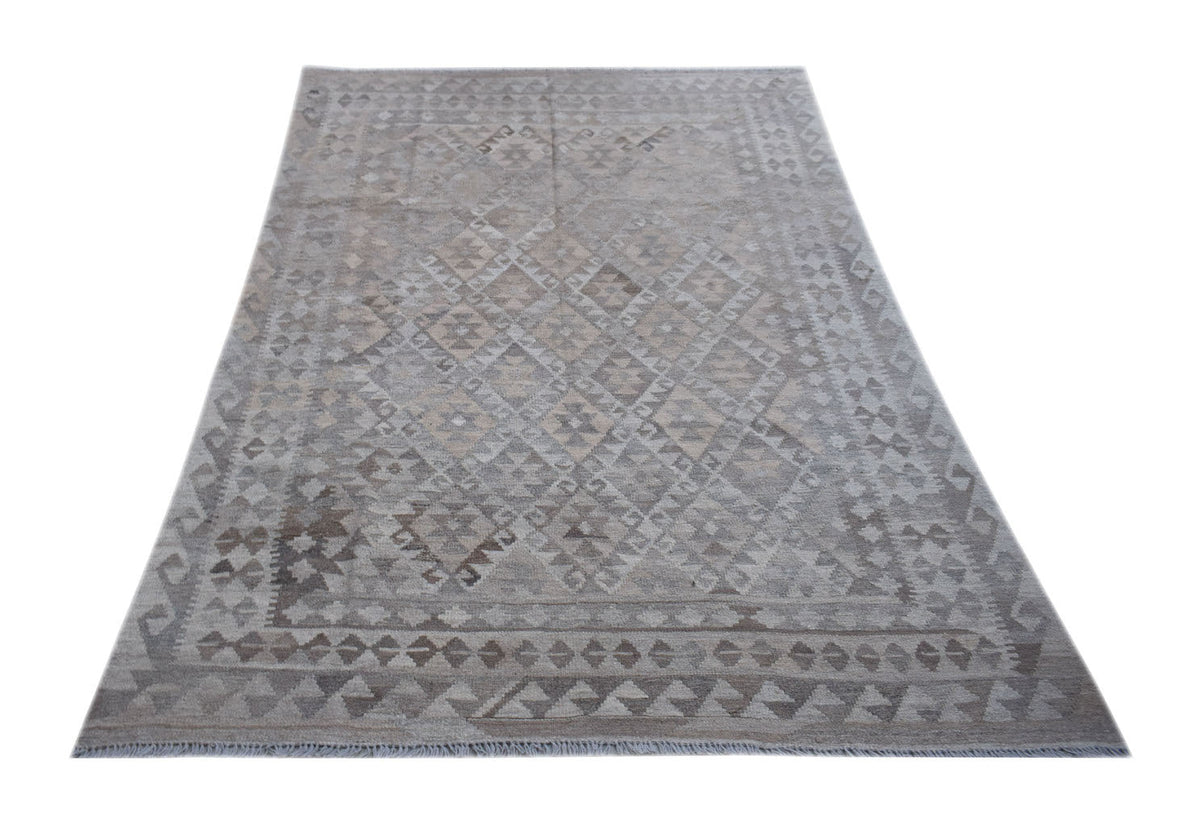 Handwoven Afghan Maimana kilim rug featuring a neutral geometric pattern in undyed natural wool.