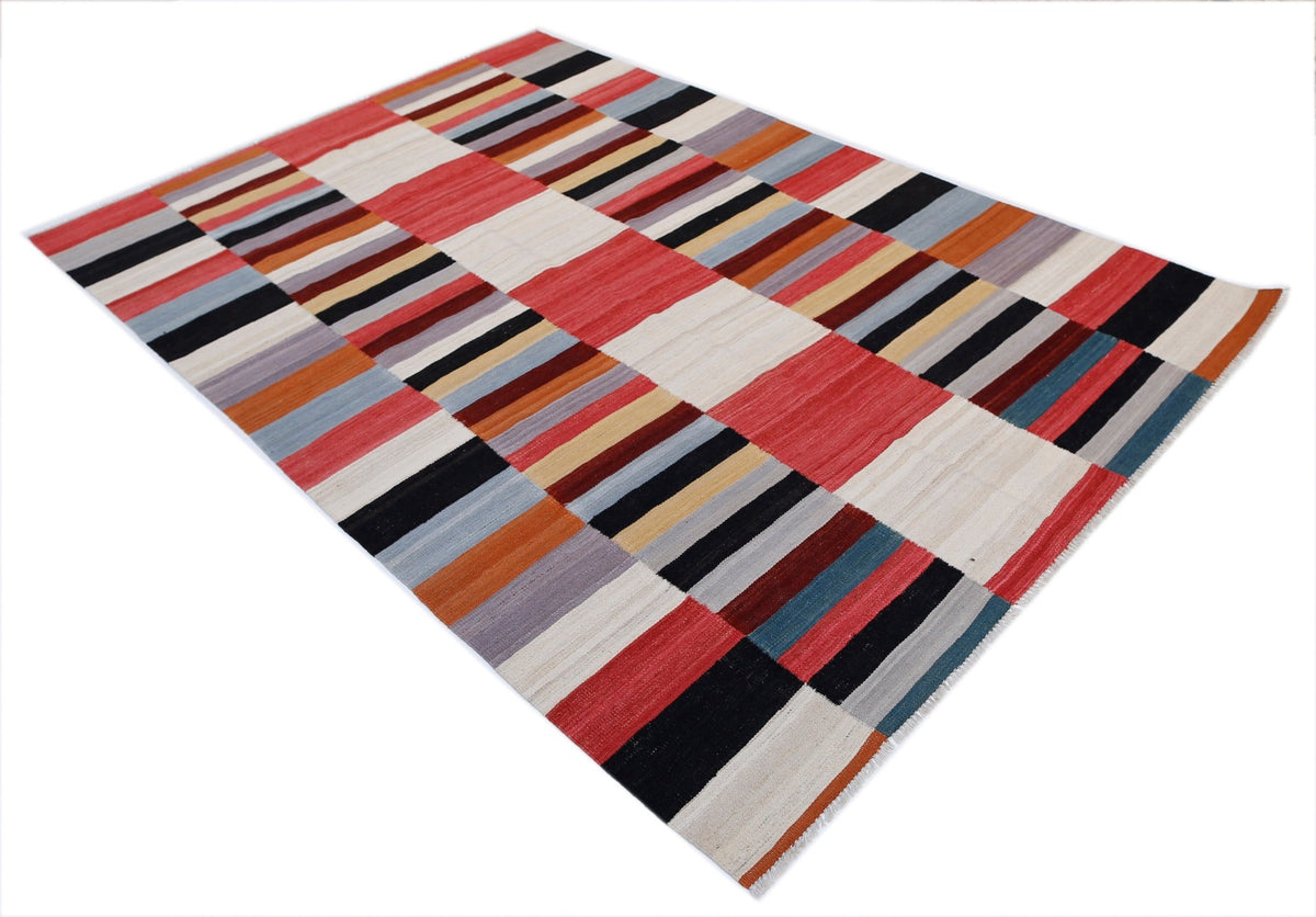 Handwoven Afghan Maimana kilim featuring a geometric block pattern in red, black, blue, and cream Ghazni wool.