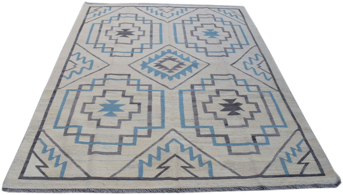 Handmade Afghan Maimana kilim rug featuring a geometric pattern in blue, grey, and cream wool.