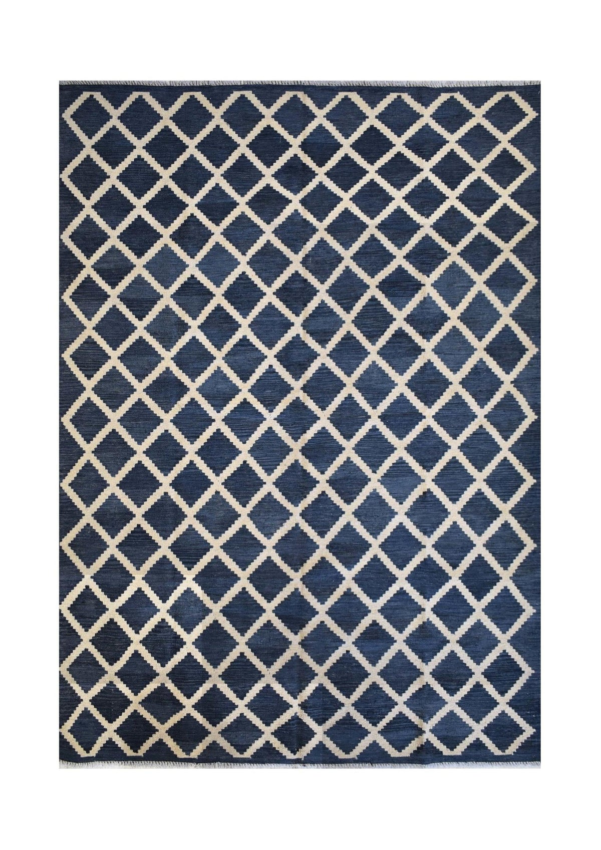 Handmade Afghan Maimana kilim rug featuring a dark blue field with a cream diamond grid pattern.