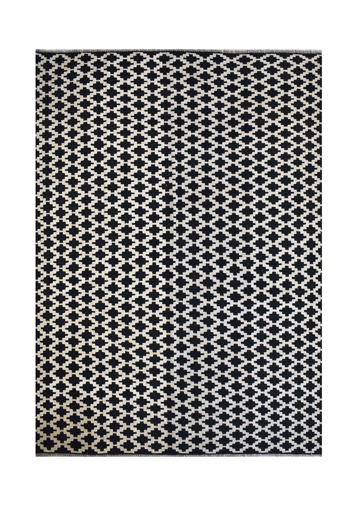 Handmade Afghan Maimana kilim rug featuring a black and white geometric pattern.