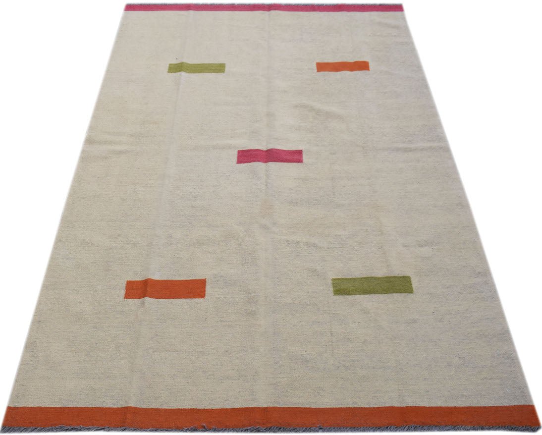 Handwoven Afghan Maimana kilim rug with a cream field and colorful geometric accents.