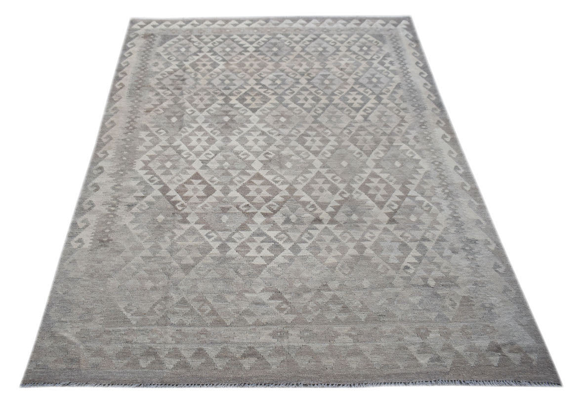 Handwoven Afghan Maimana kilim rug featuring a neutral-toned geometric pattern in natural wool.