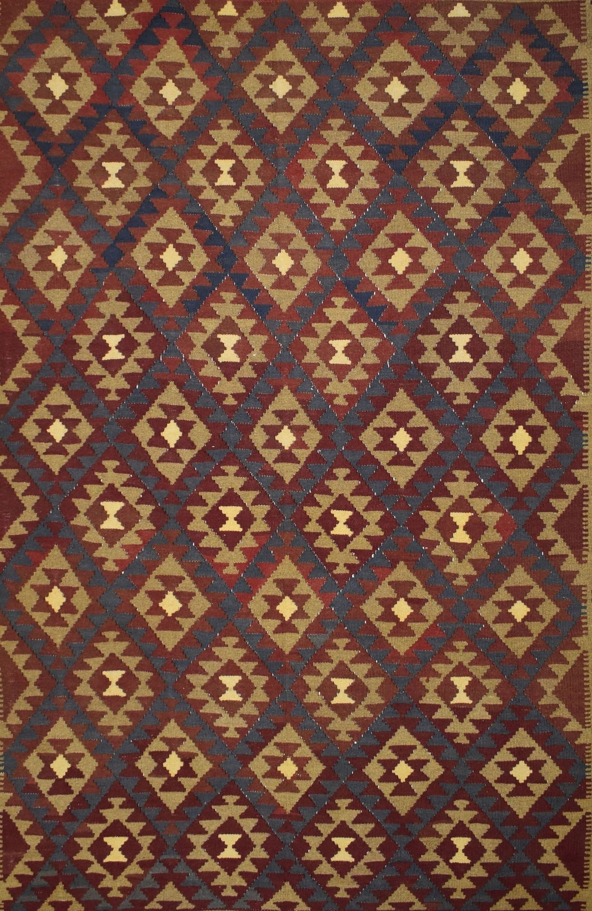 Handmade Afghan Maimana kilim rug featuring a repeating geometric diamond pattern in earthy tones.