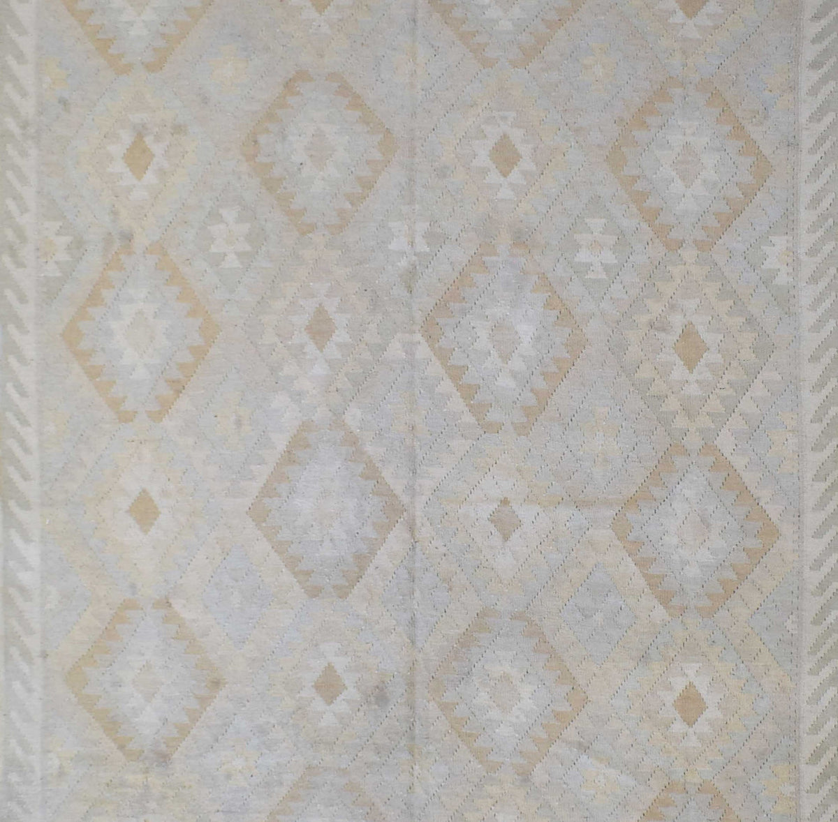 Handmade Afghan Maimana kilim rug featuring a geometric diamond pattern in neutral tones.