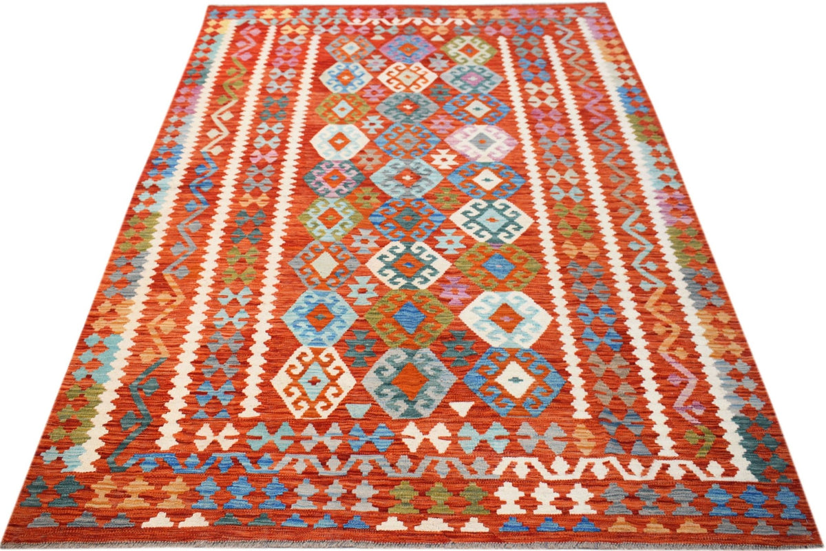 Handwoven Afghan Maimana kilim rug featuring a vibrant red field with geometric diamond patterns.