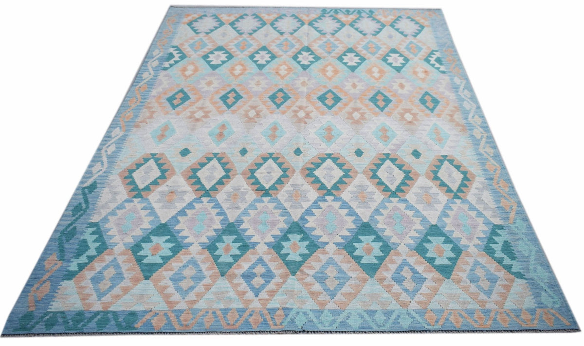Handwoven Afghan Maimana kilim rug featuring a geometric diamond pattern in blue and peach tones.