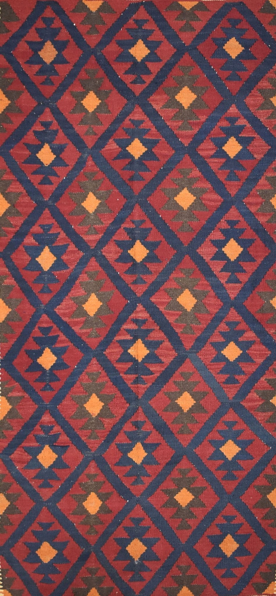 Handmade Afghan Maimana kilim rug featuring a repeating geometric diamond pattern in red and blue.