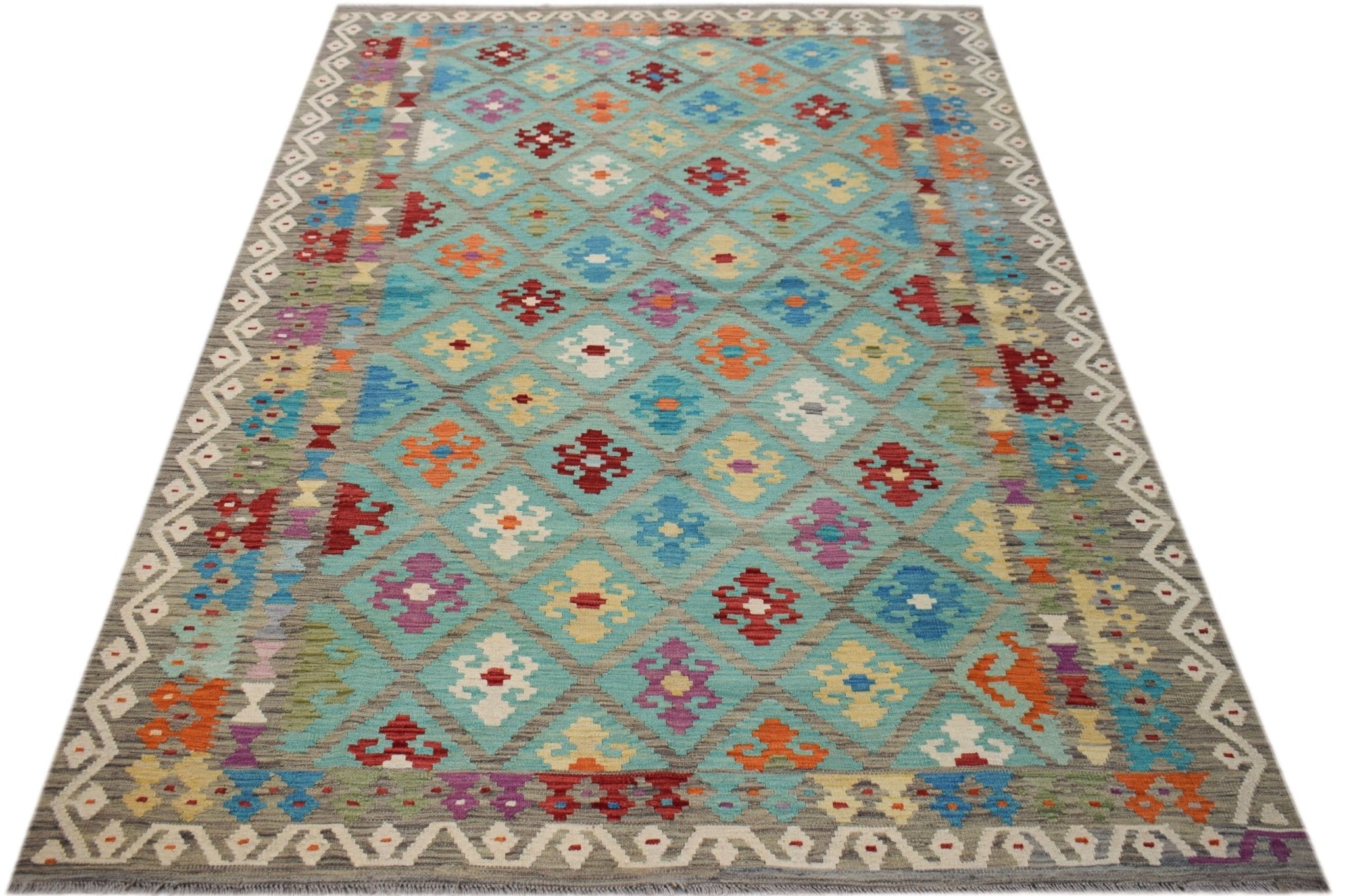 Handwoven Afghan Maimana kilim rug featuring a colorful geometric diamond pattern on a blue field.