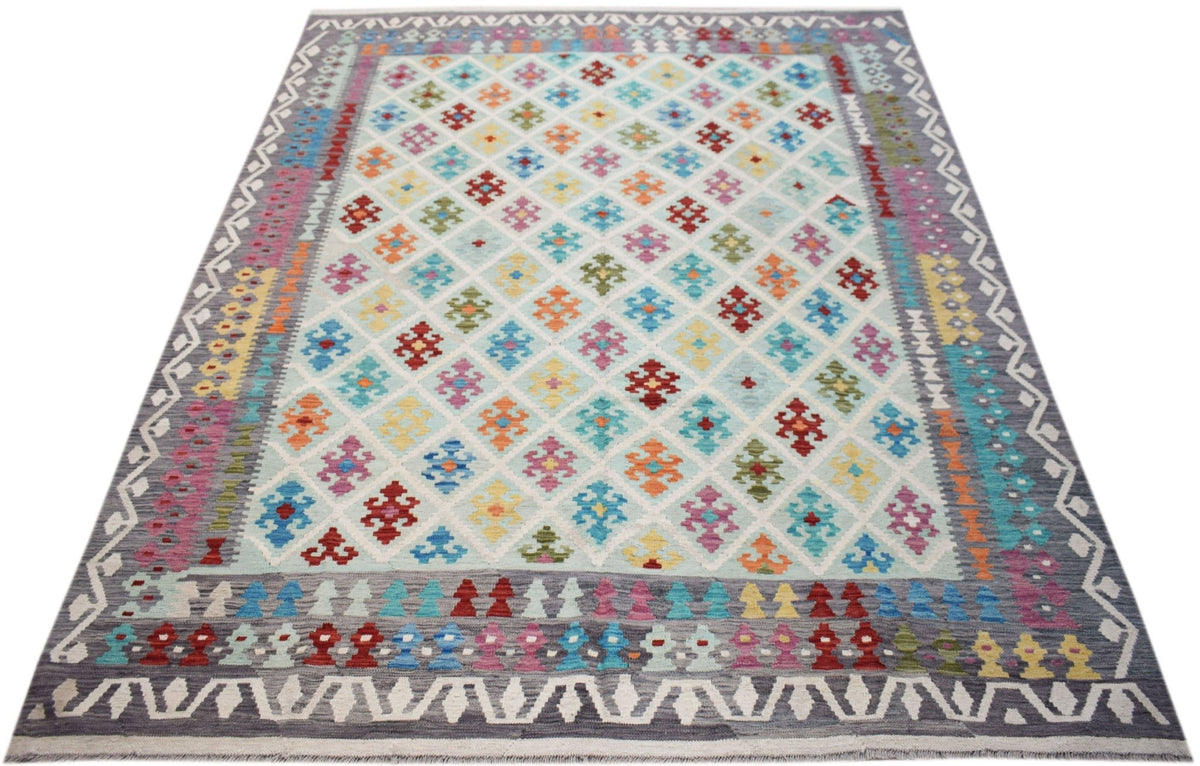 Handwoven Afghan Maimana kilim rug featuring a colorful geometric diamond pattern on a light base.