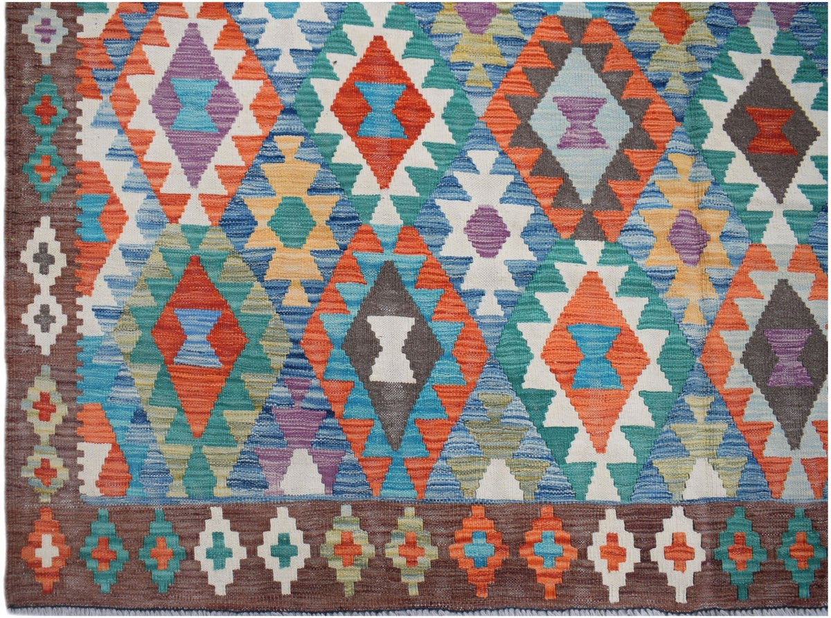 Handwoven Afghan Maimana kilim rug featuring a colorful geometric diamond pattern.