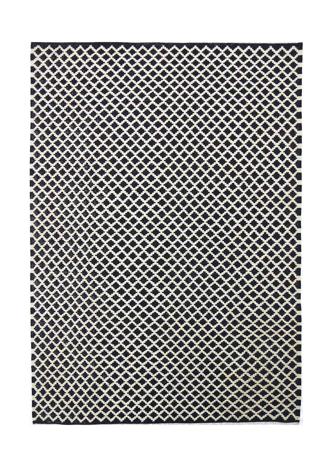 Handmade Afghan Maimana kilim rug featuring a repeating black and white geometric lattice pattern.