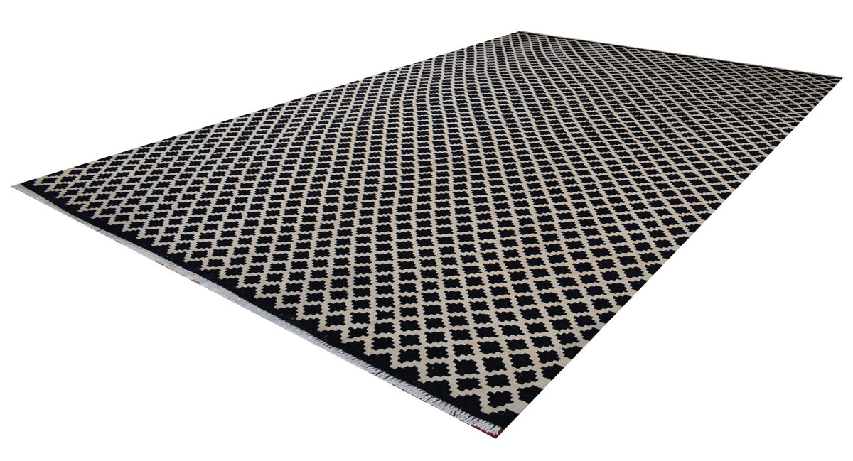Handmade Afghan Maimana kilim rug featuring a repeating black and cream geometric pattern.