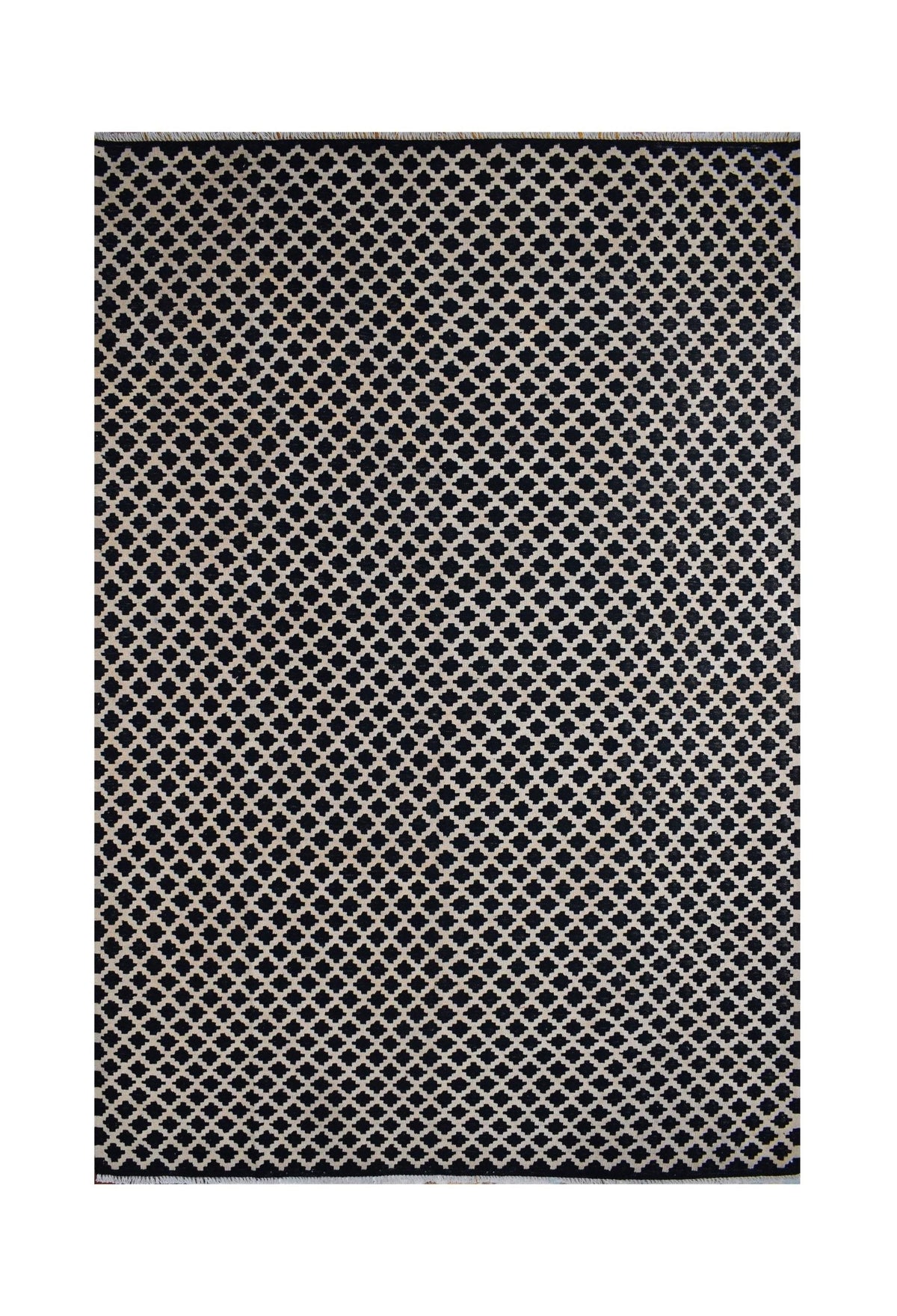 Handmade Afghan Maimana kilim rug featuring a repeating black and beige geometric pattern.