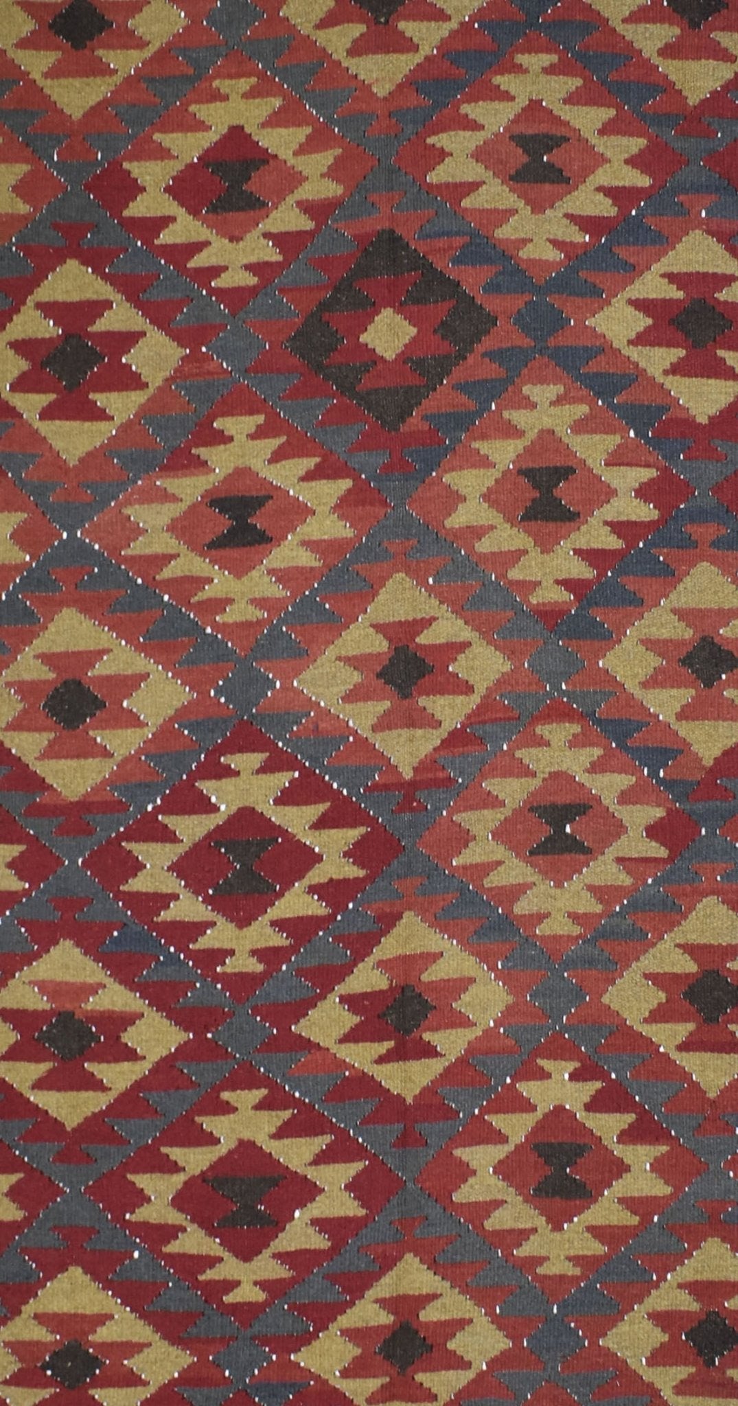 Handmade Afghan Maimana kilim rug featuring a repeating geometric diamond pattern in earthy tones.
