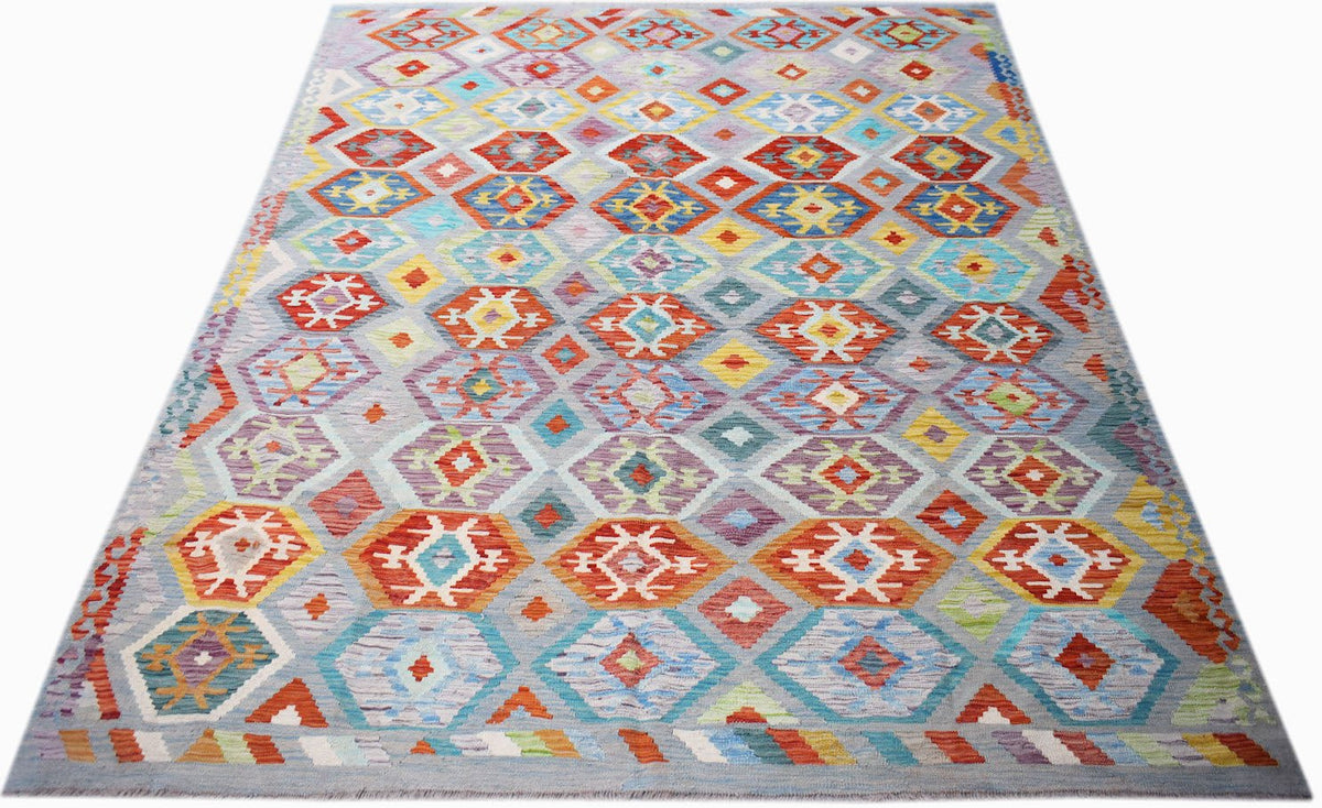 Handwoven Afghan Maimana Kilim rug featuring a colorful geometric diamond pattern on a grey base.