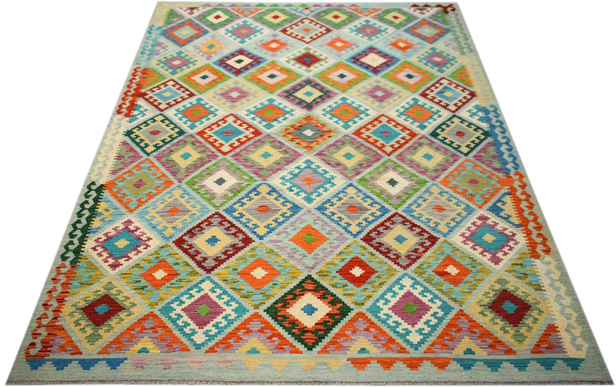 Handwoven Afghan Maimana kilim rug featuring a vibrant, multicolored geometric diamond pattern.