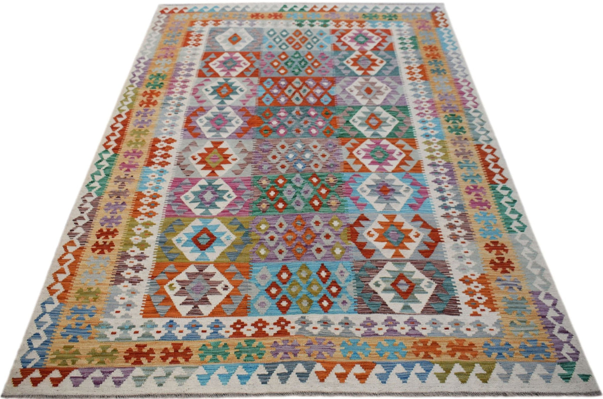 Handwoven Afghan Maimana Kilim rug featuring a colorful geometric pattern in a flatweave style.