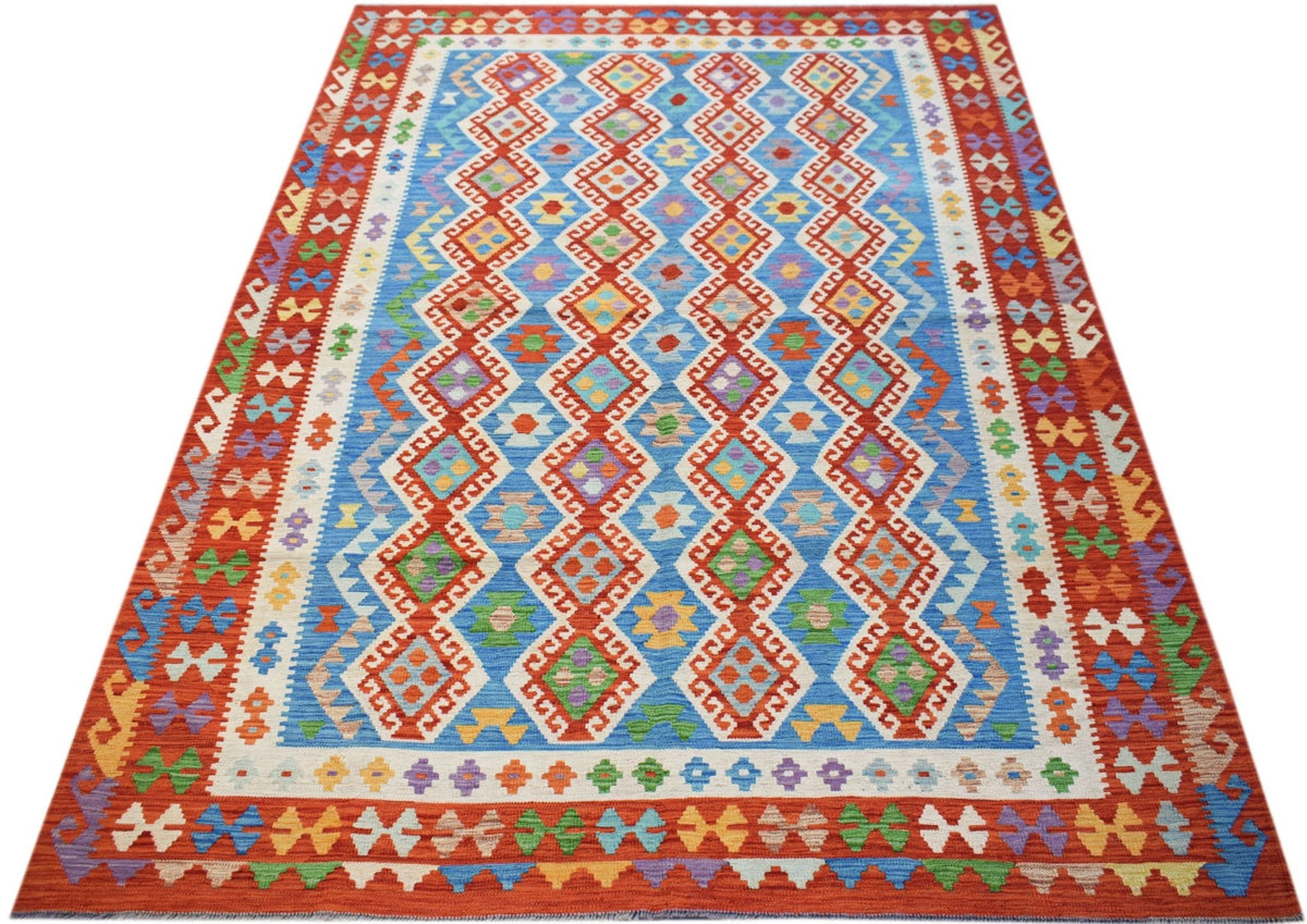 Handwoven Afghan Maimana kilim featuring a blue field with colorful geometric diamond patterns.
