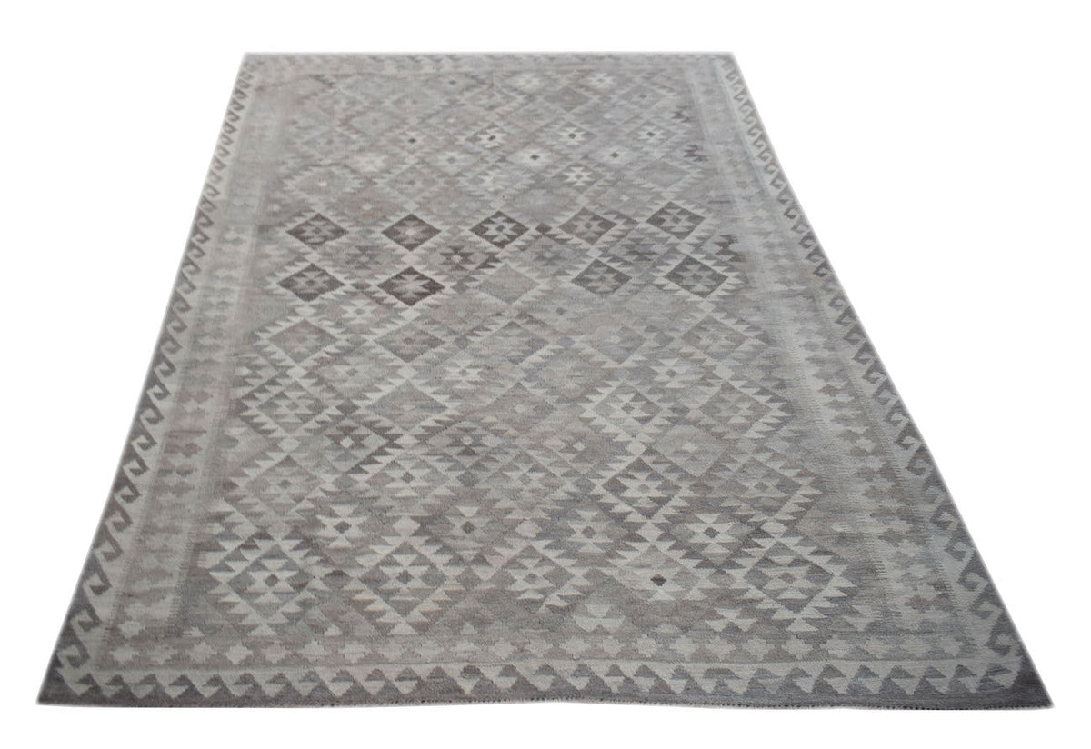 Handwoven Afghan Maimana kilim rug featuring a geometric pattern in neutral grey wool tones.