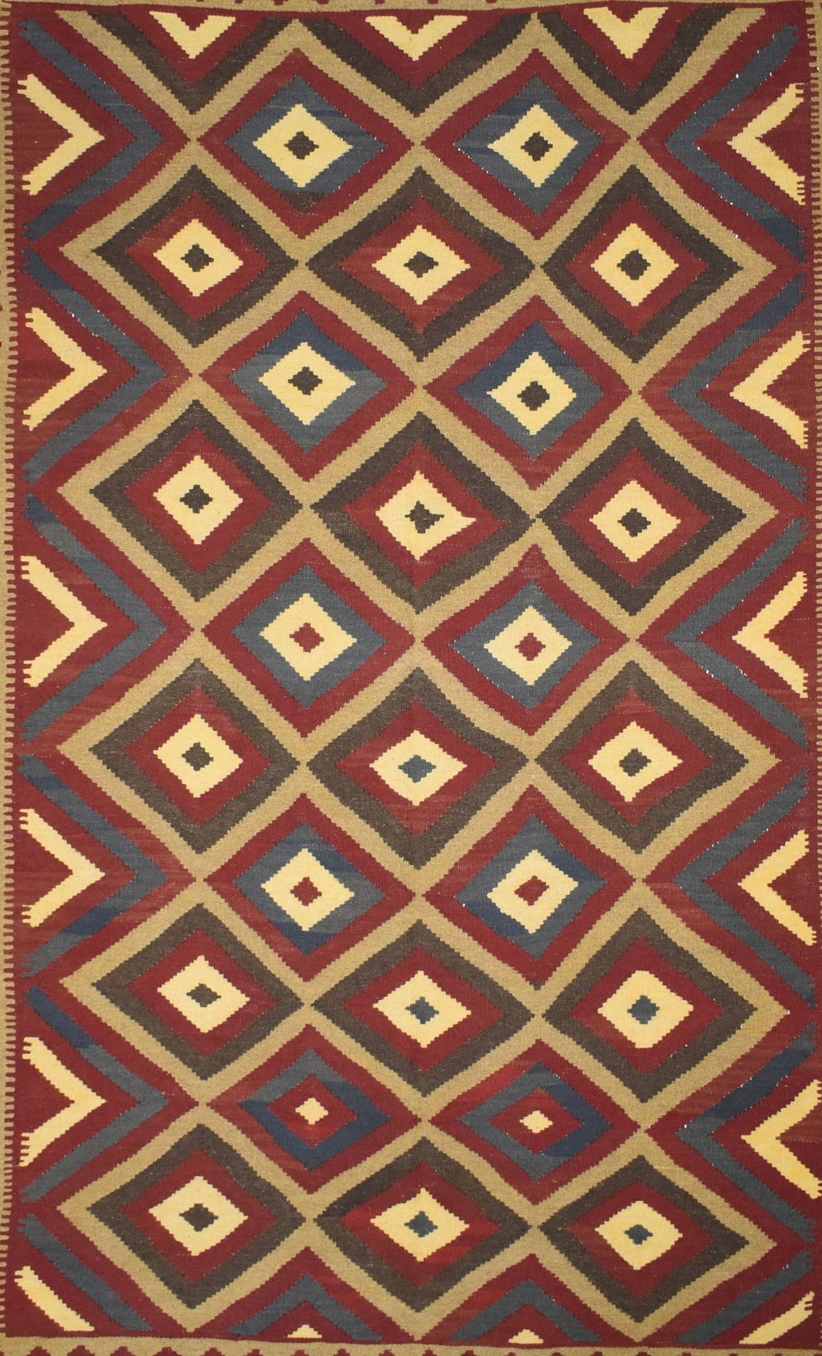Handmade Afghan Maimana kilim rug featuring a repeating geometric diamond pattern in earthy tones.