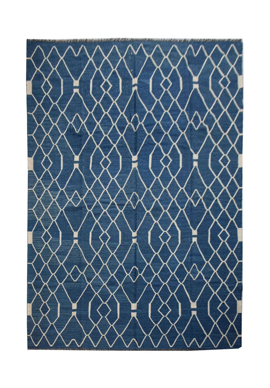 Handwoven Afghan Maimana wool kilim featuring a blue field with a white geometric diamond pattern.
