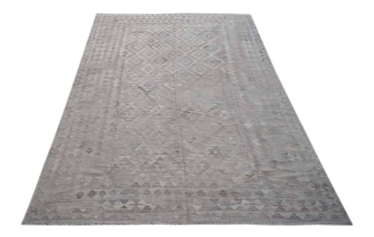 Handwoven Afghan Maiamana kilim rug featuring a neutral geometric pattern in natural wool.