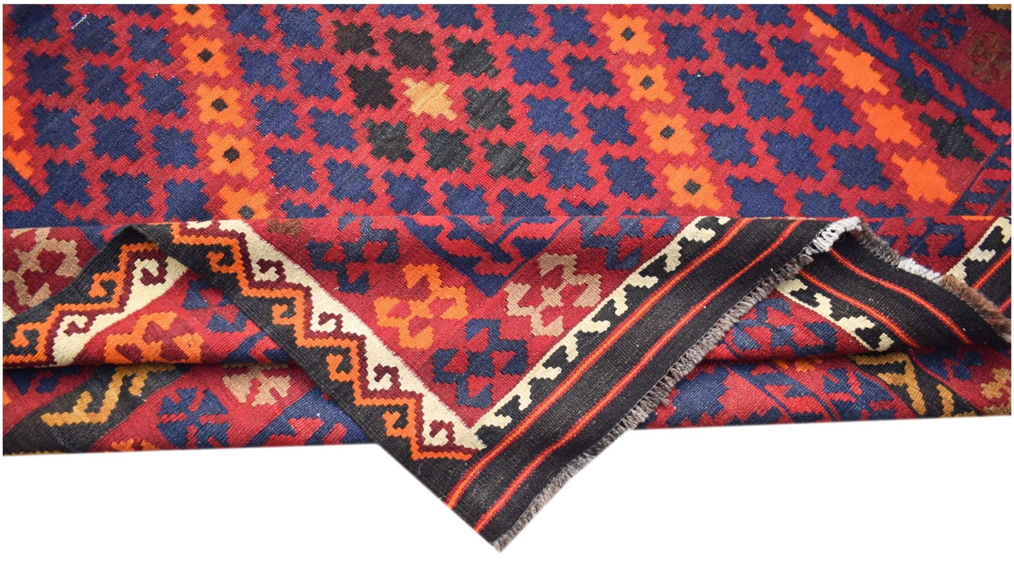 Handwoven Afghan Maimana kilim featuring a geometric pattern in red, blue, and orange wool.