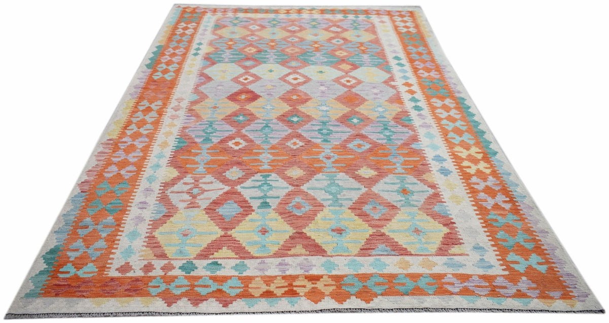 Handwoven Afghan Maimana kilim rug featuring a colorful geometric diamond pattern.