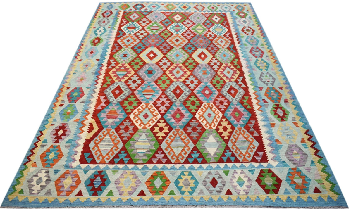 Handwoven Afghan Maimana Kilim rug featuring a vibrant geometric diamond pattern in wool.