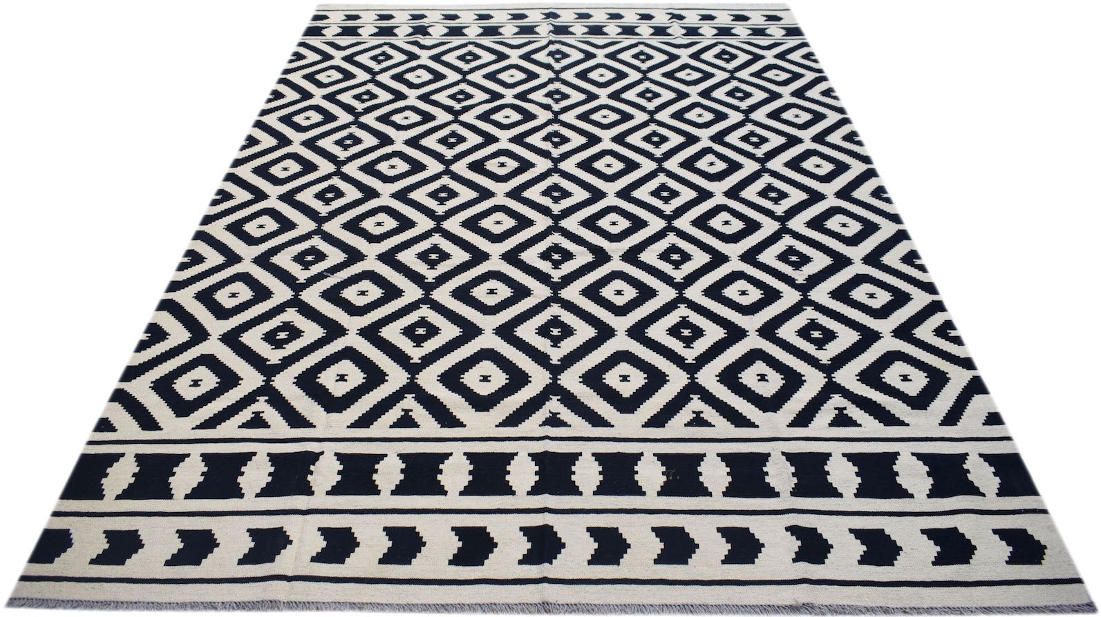 Handwoven Afghan Maimana kilim rug featuring a black and white geometric diamond pattern.