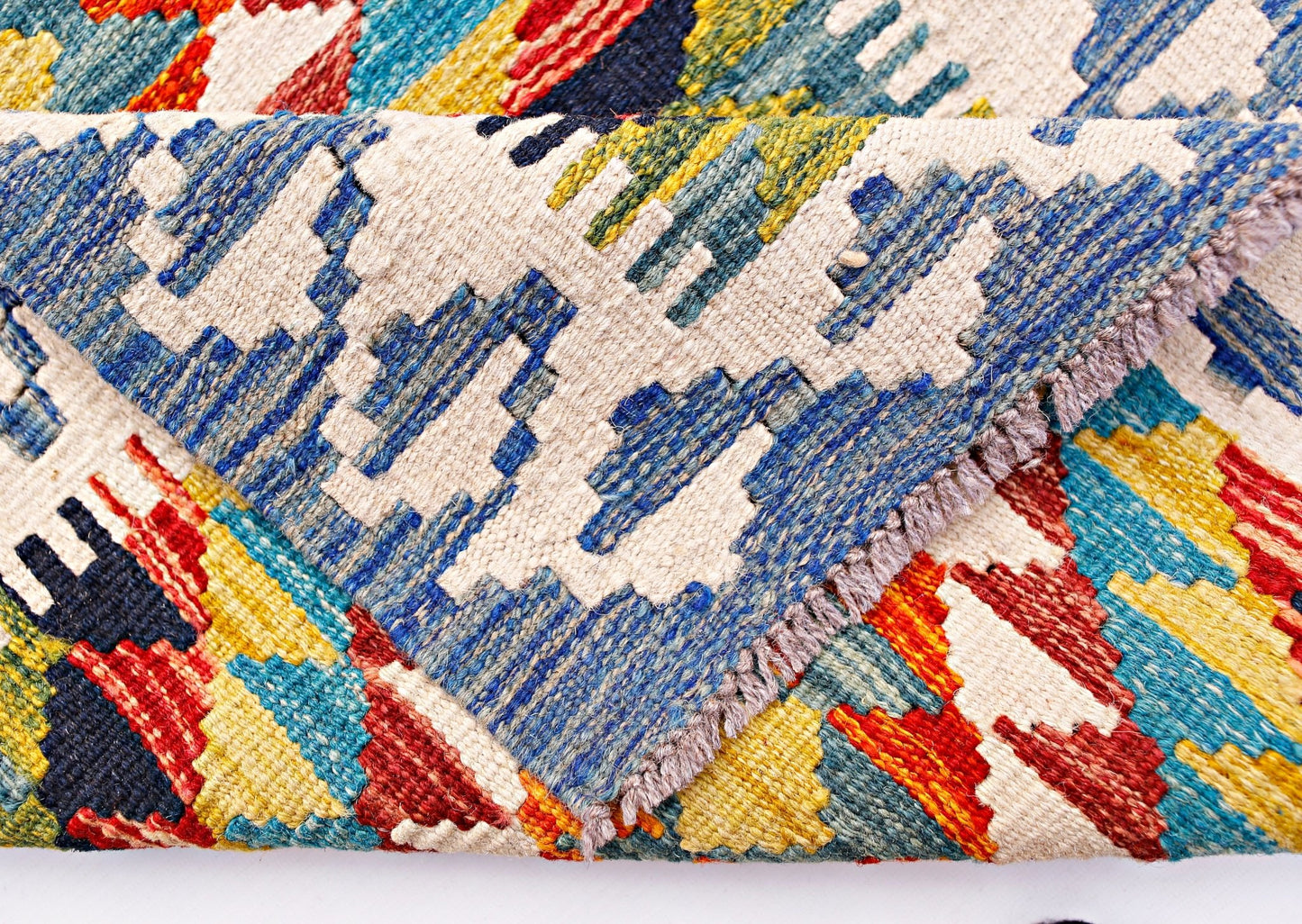 A handwoven Afghan Maimana wool kilim runner featuring a colorful geometric pattern.