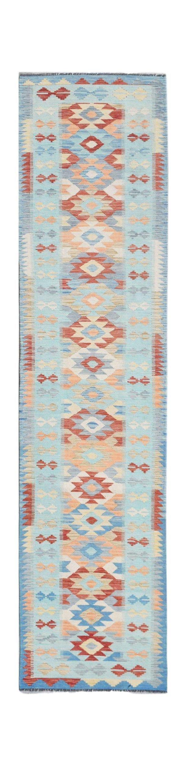 Handwoven Afghan Maimana wool runner rug featuring a light blue background and geometric patterns.