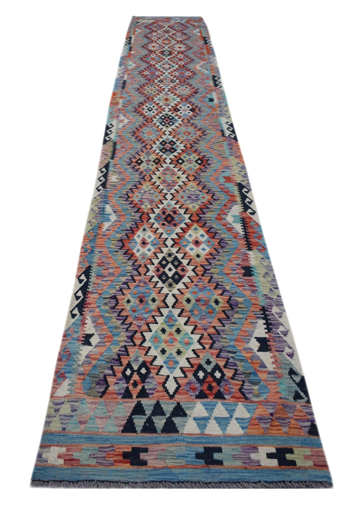 Handwoven Afghan Maimana kilim runner in multicoloured geometric patterns with Ghazni wool and a fringed edge.