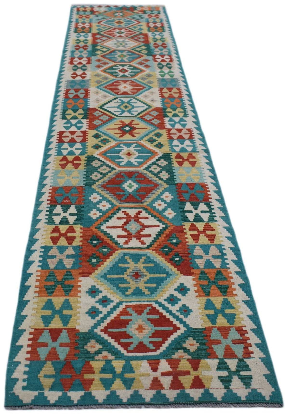A handmade Afghan Maimana wool runner featuring a colorful geometric pattern.
