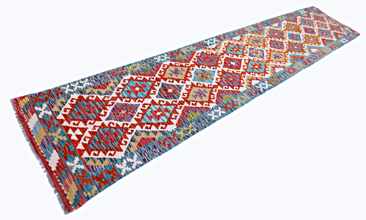 Handwoven Afghan Maimana kilim runner featuring a vibrant geometric diamond pattern in red, blue, and yellow Ghazni wool.