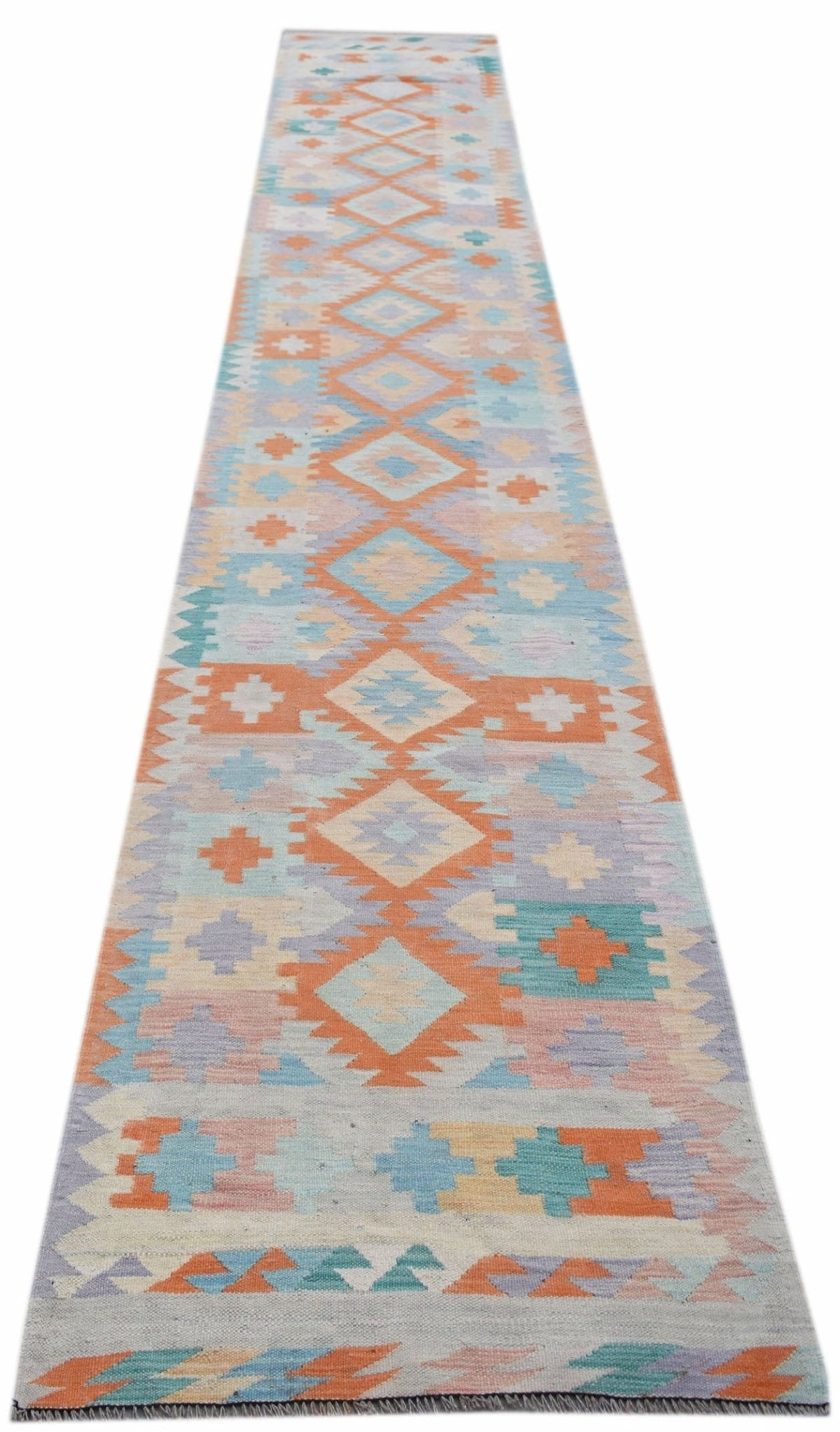 Handwoven Afghan Maimana kilim runner featuring geometric patterns in soft orange, blue, and cream Ghazni wool.