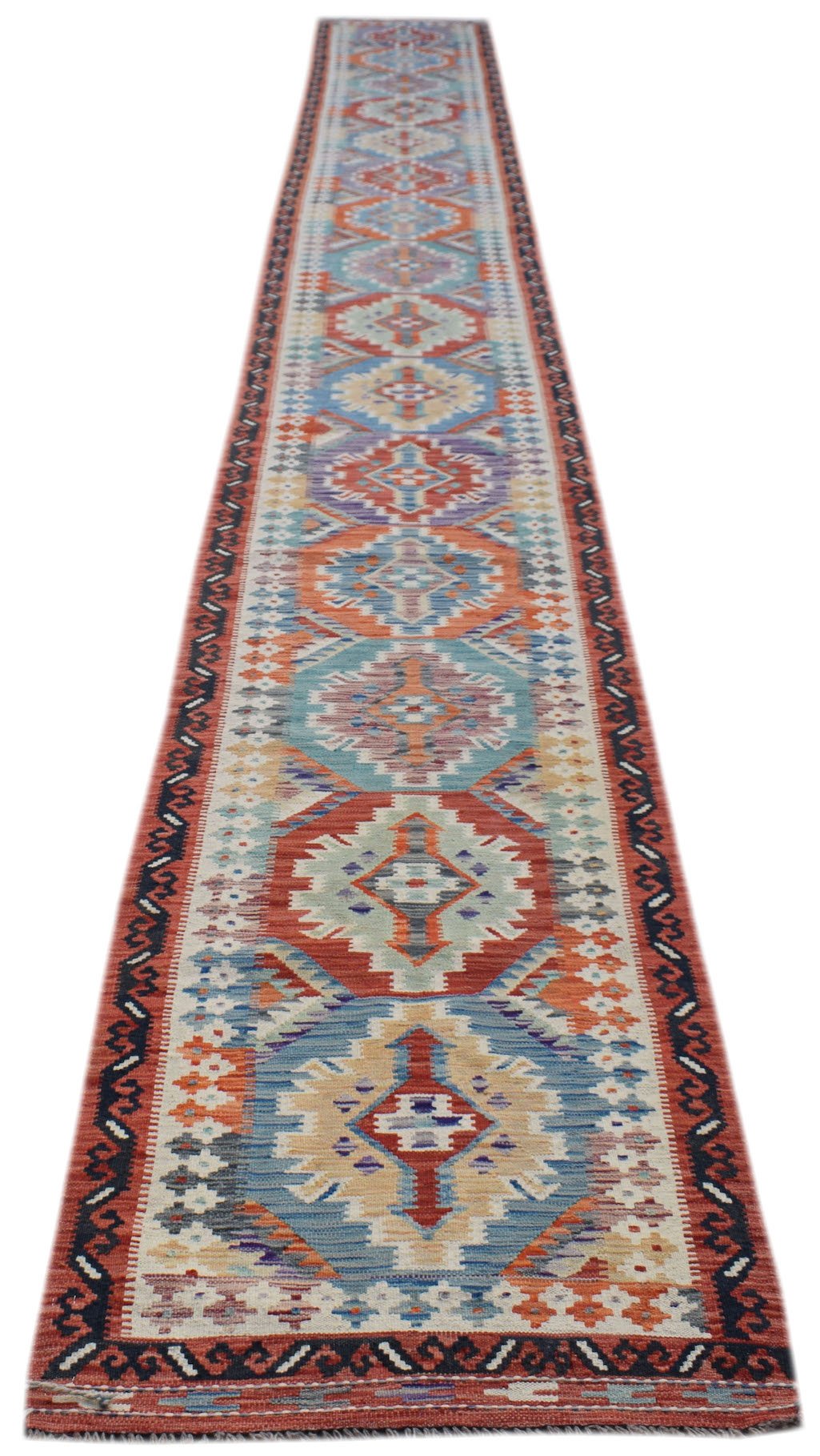 Handwoven Afghan Maimana wool runner featuring a colorful geometric pattern on a flatweave texture.