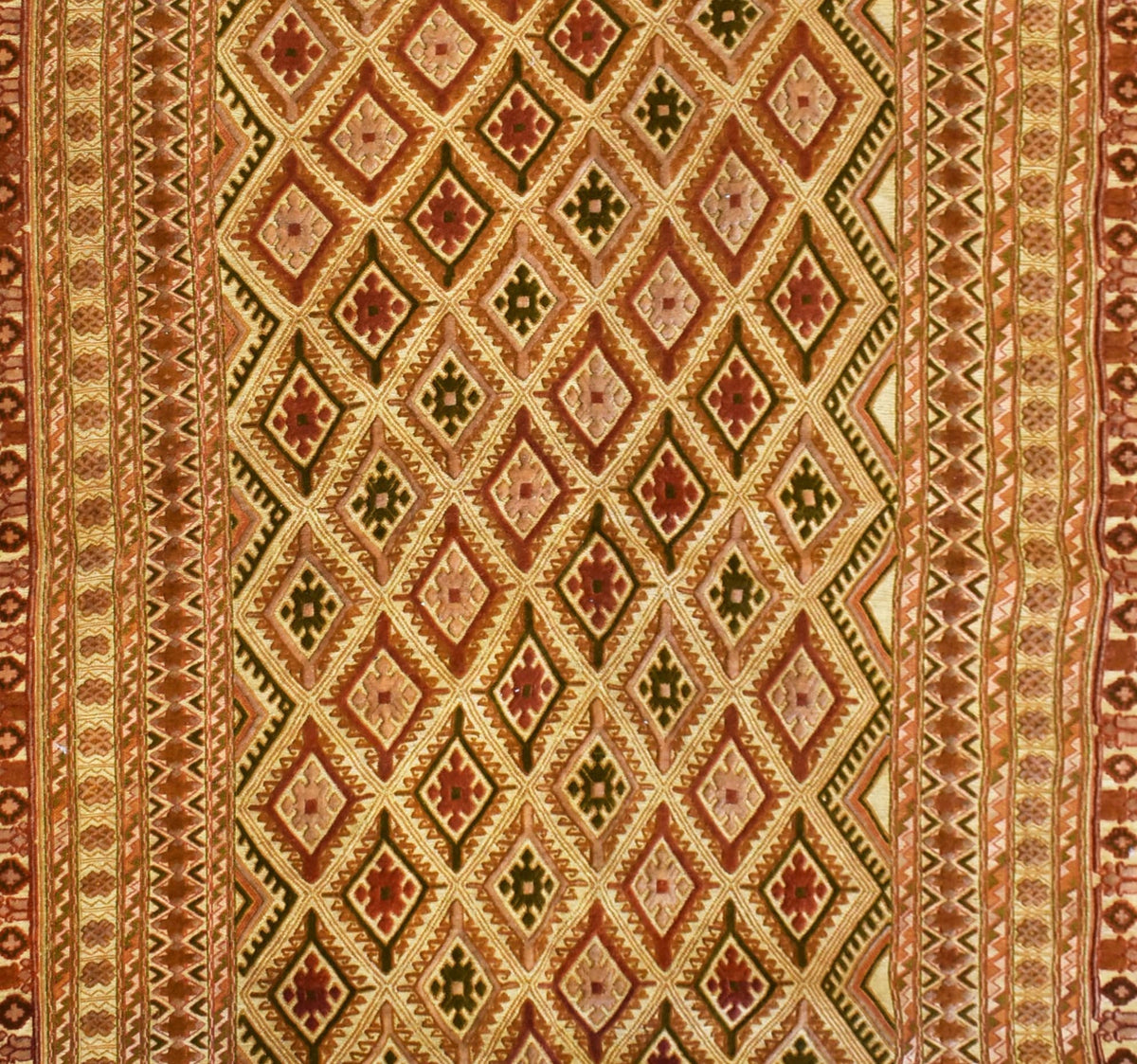 Handmade Afghan Mashwani rug featuring intricate geometric diamond patterns in warm earth tones.