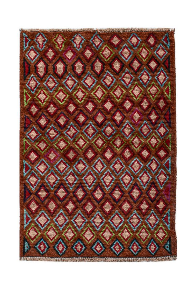 A handmade Afghan Pashm rug featuring a repeating diamond pattern in shades of red, blue, and brown.