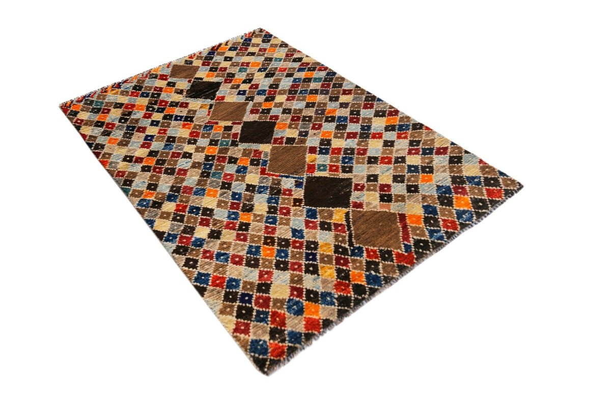 Hand-knotted Afghan Pashm wool rug featuring a dense, shaggy pile and a colourful geometric diamond pattern.