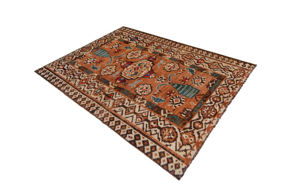 Hand-knotted Afghan Pashm wool rug with a dense, shaggy pile and bold geometric tribal patterns in rust and blue tones.
