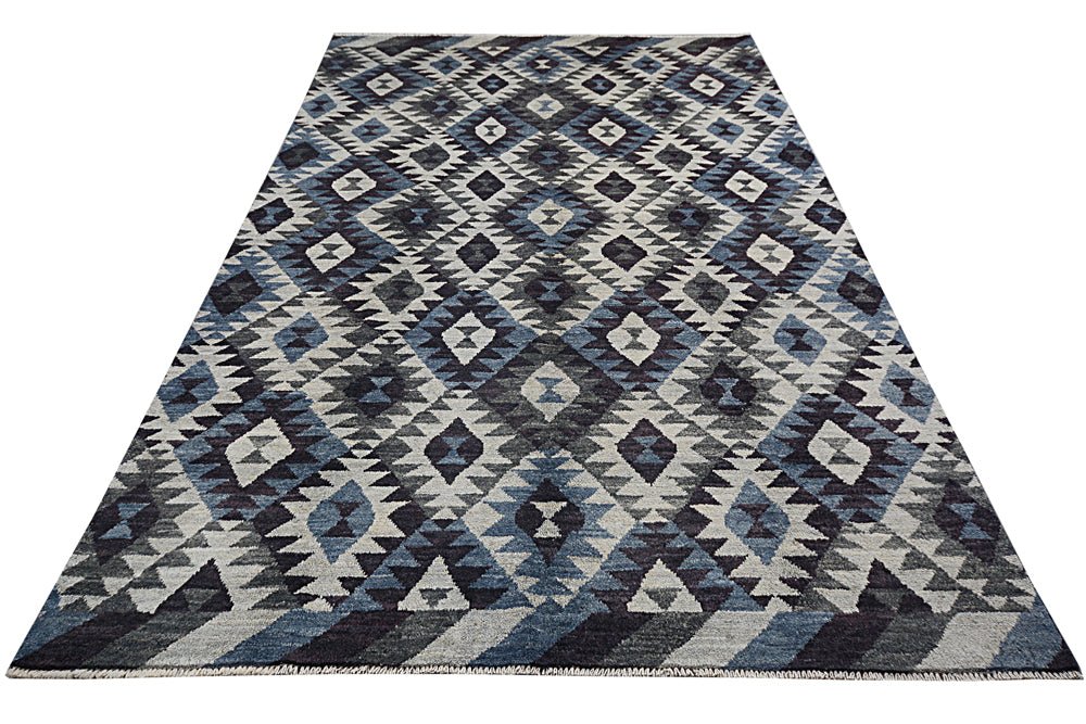 Handmade Afghan wool rug featuring a geometric diamond pattern in shades of blue, grey, and white.