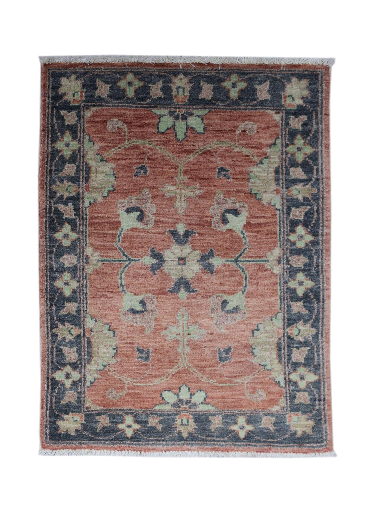Hand-knotted mini Afghan Chobi rug with a terracotta field, dark blue border, and intricate floral motifs with fringe.