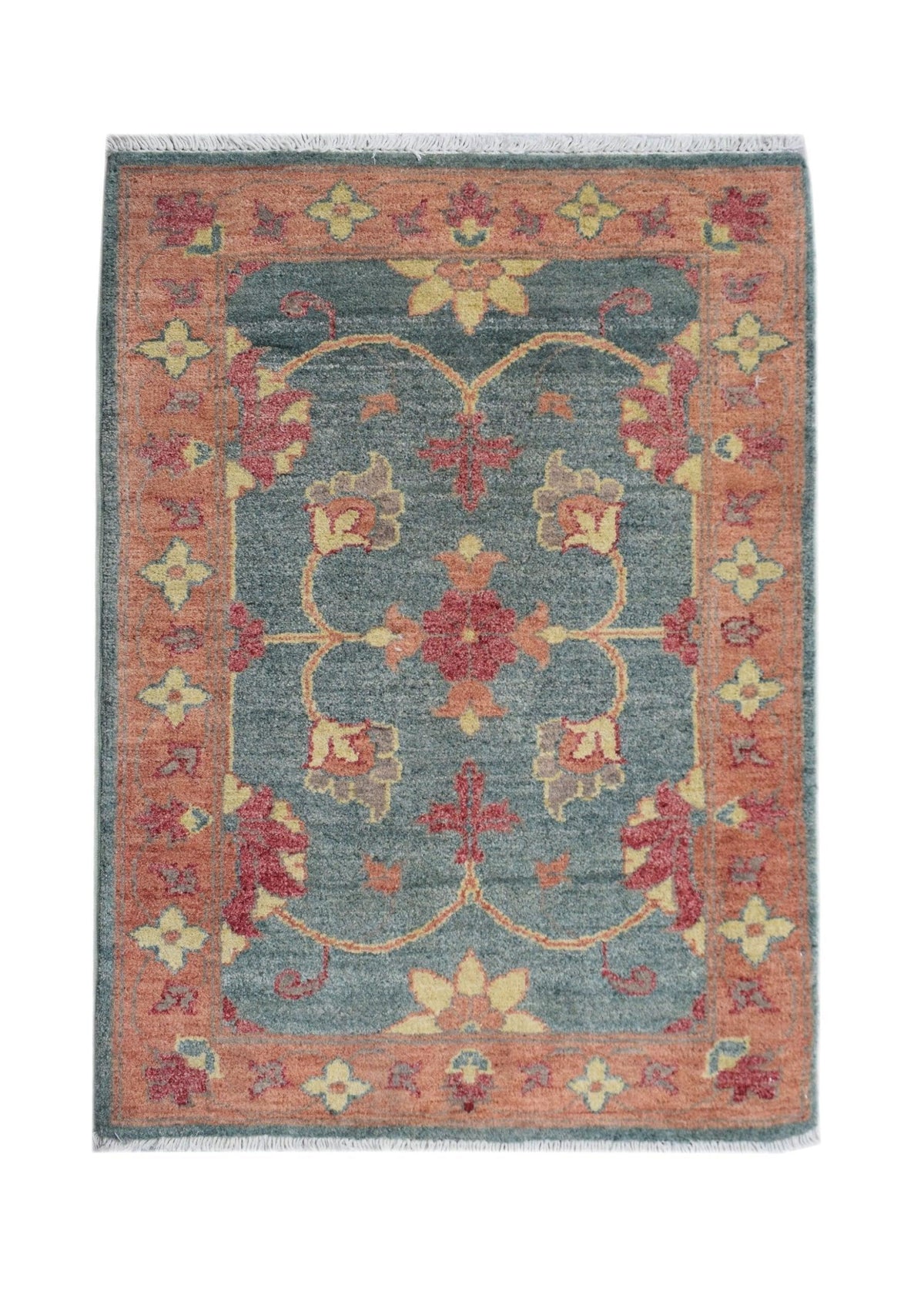 Miniature Afghan Chobi rug with a blue field, rust border, floral motifs, and short white fringe on a white background.