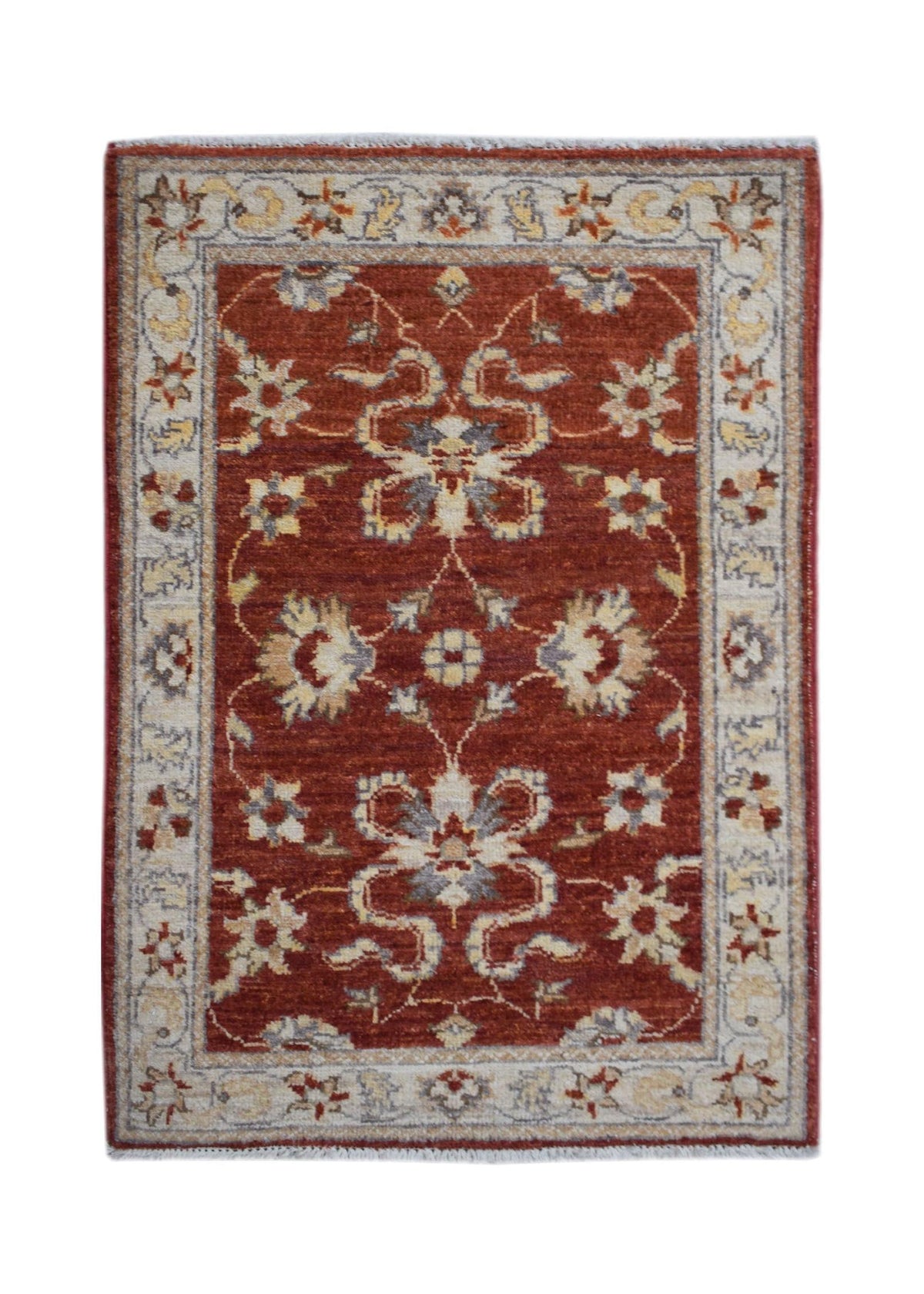 Hand-knotted miniature Afghan Chobi rug in terracotta red with intricate floral motifs and a cream border.