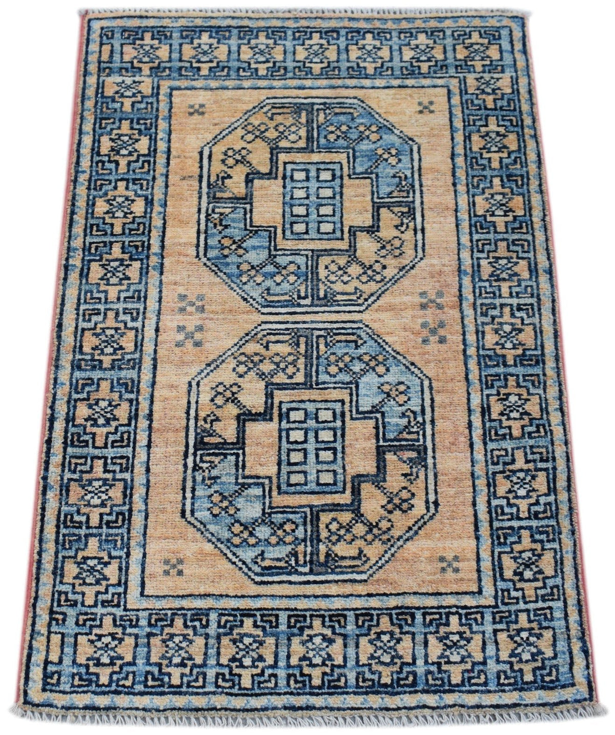 Miniature Afghan Chobi rug with blue and beige geometric motifs, fine borders, and a hand-knotted wool pile with fringe.