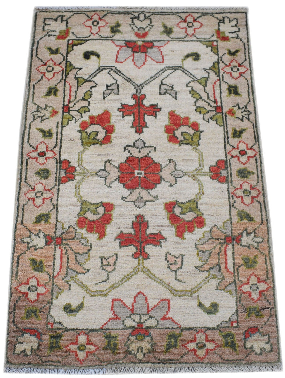 Hand-knotted mini Afghan Chobi rug with a cream field, red floral motifs, and green accents, finished with a short fringe.